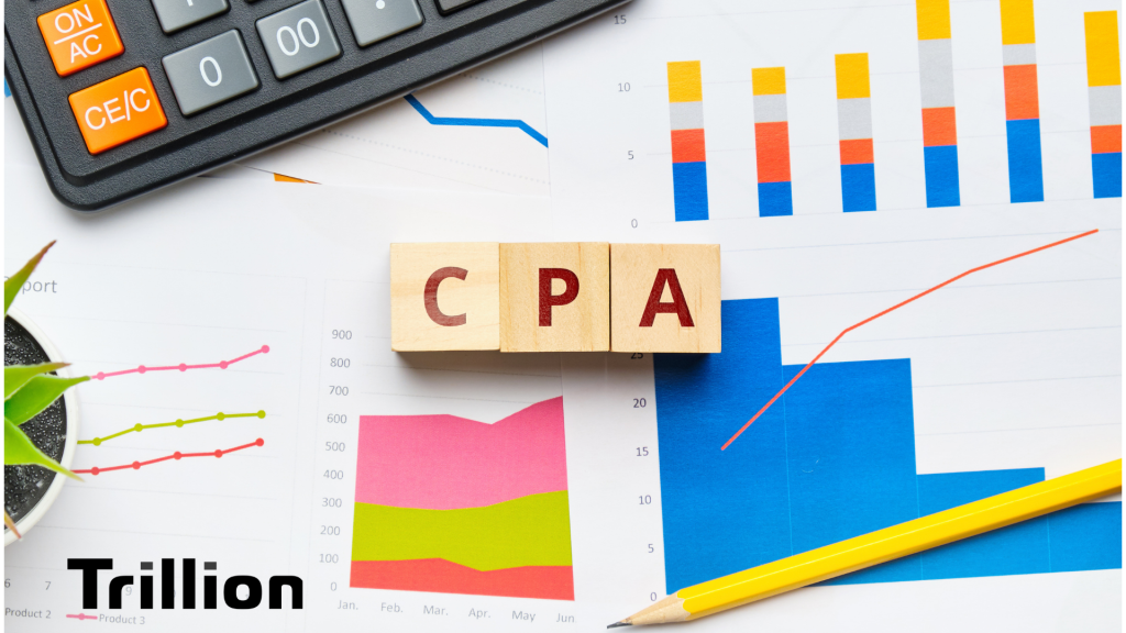 CPA blocks on a desk with graphs and charts